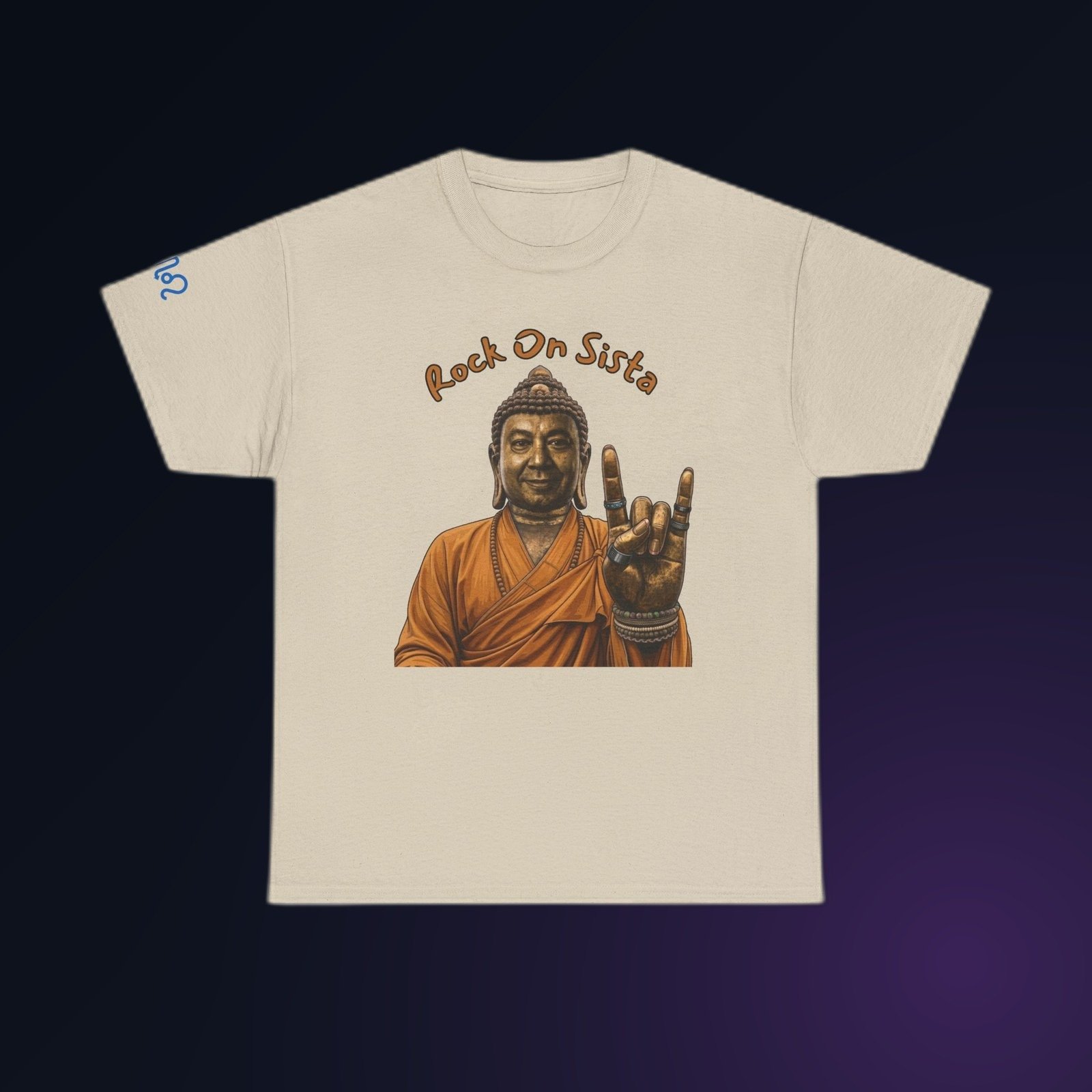 Sand Gildan 5000 t-shirt printed with an illustrated Buddha figure in warm bronze and amber tones, throwing the “rock on” horns hand sign and the arced text “Rock On Bratha”.
