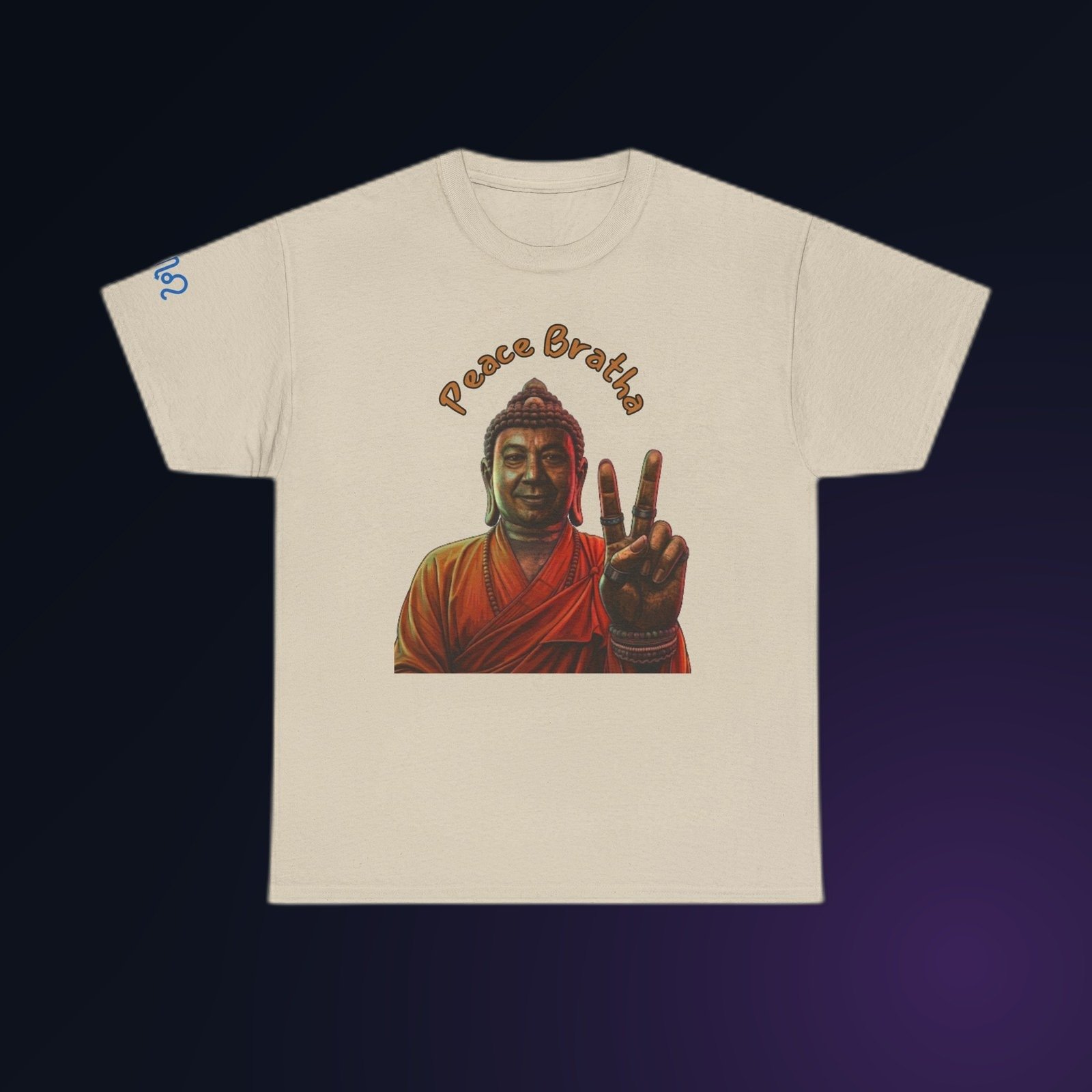 Sand Gildan 5000 t-shirt printed with an illustrated Buddha figure in warm, sun-washed tones, holding up a two-finger peace sign and the arced text “Peace Bratha”.